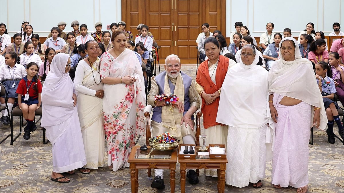 5 Widowed Women Tie Rakhi to PM Modi