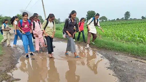 MP Village Students Walk On Muddy Road To School