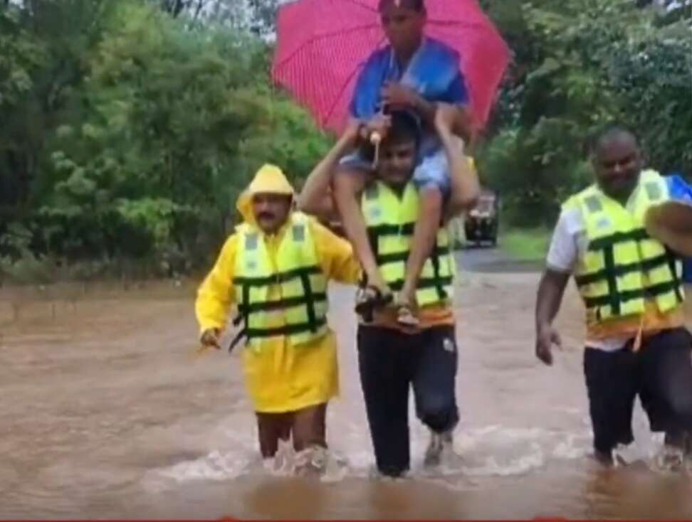 Cop Carries Woman to Safety in Flooded Raigad