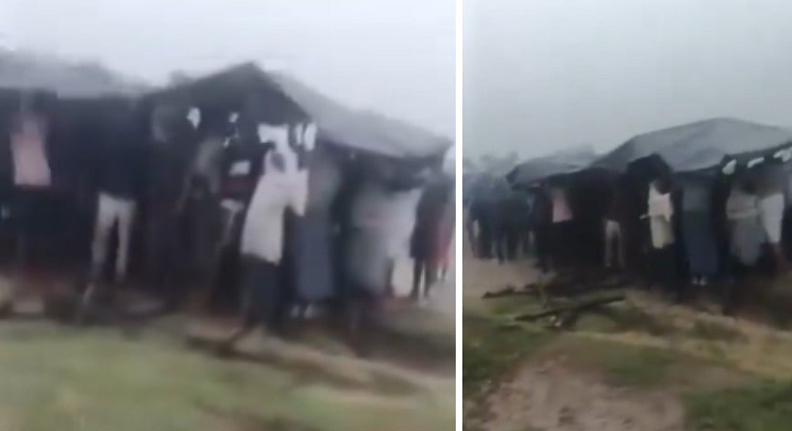 Villagers Burn Pyre Under Plastic Sheets In Open Field Amid Rain